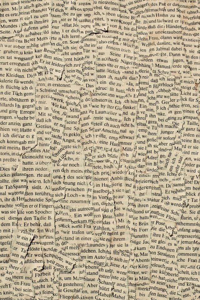 Newspaper pages spread on a table